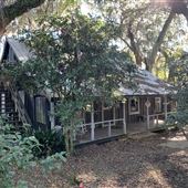 Creole Cottage Circa 1800. Live Oaks with Spanish Moss